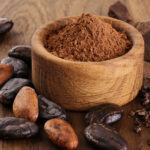 Cocoa,Beans,,Powder,,Crushed,Cocoa,Beans,And,Chocolate,On,Wooden